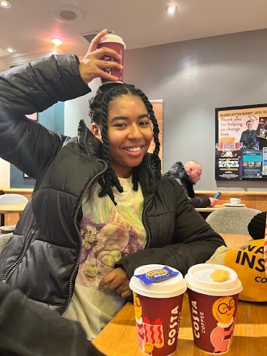 Picture of a woman with a coffee cup on their head