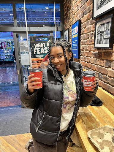 Picture of a woman holding two coffee cups